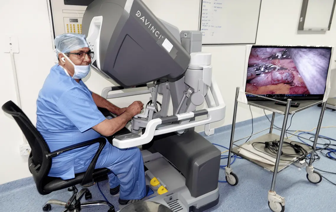 Doctor Rajesh inside Imaging room looking at a screen with patient's image on it